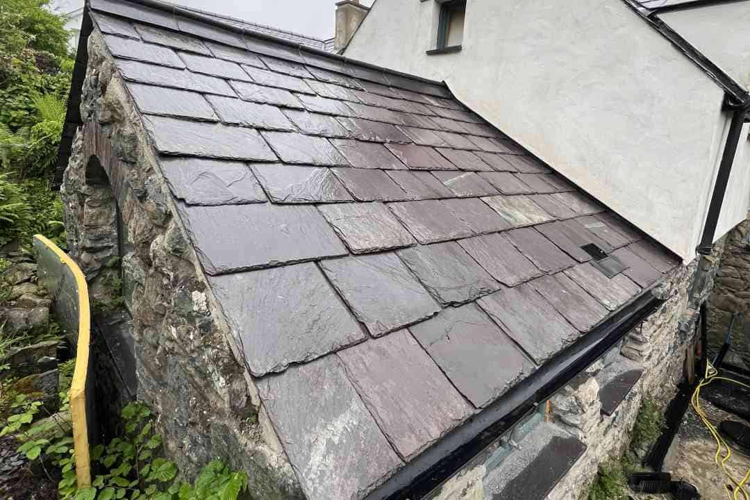 Working on roof restoration in Abersoch Working on roof restoration in Abersoch, North Wales